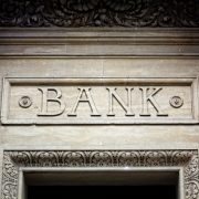 Bank sign on building Old bank sign engraved in stone or concrete above the door of financial building concept for finance and business